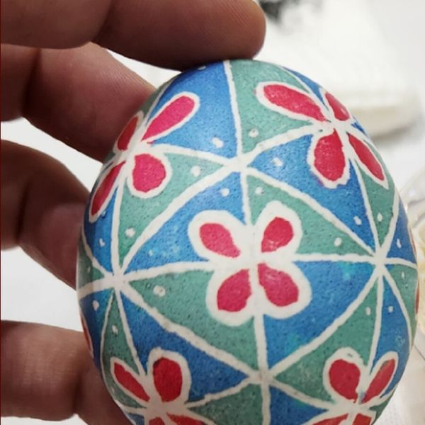 A hand-dyed Easter egg with flower patterns